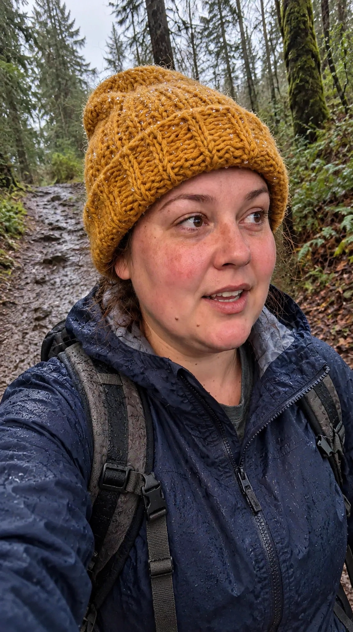 Echo in a mustard knit toque on a rainy-day hike